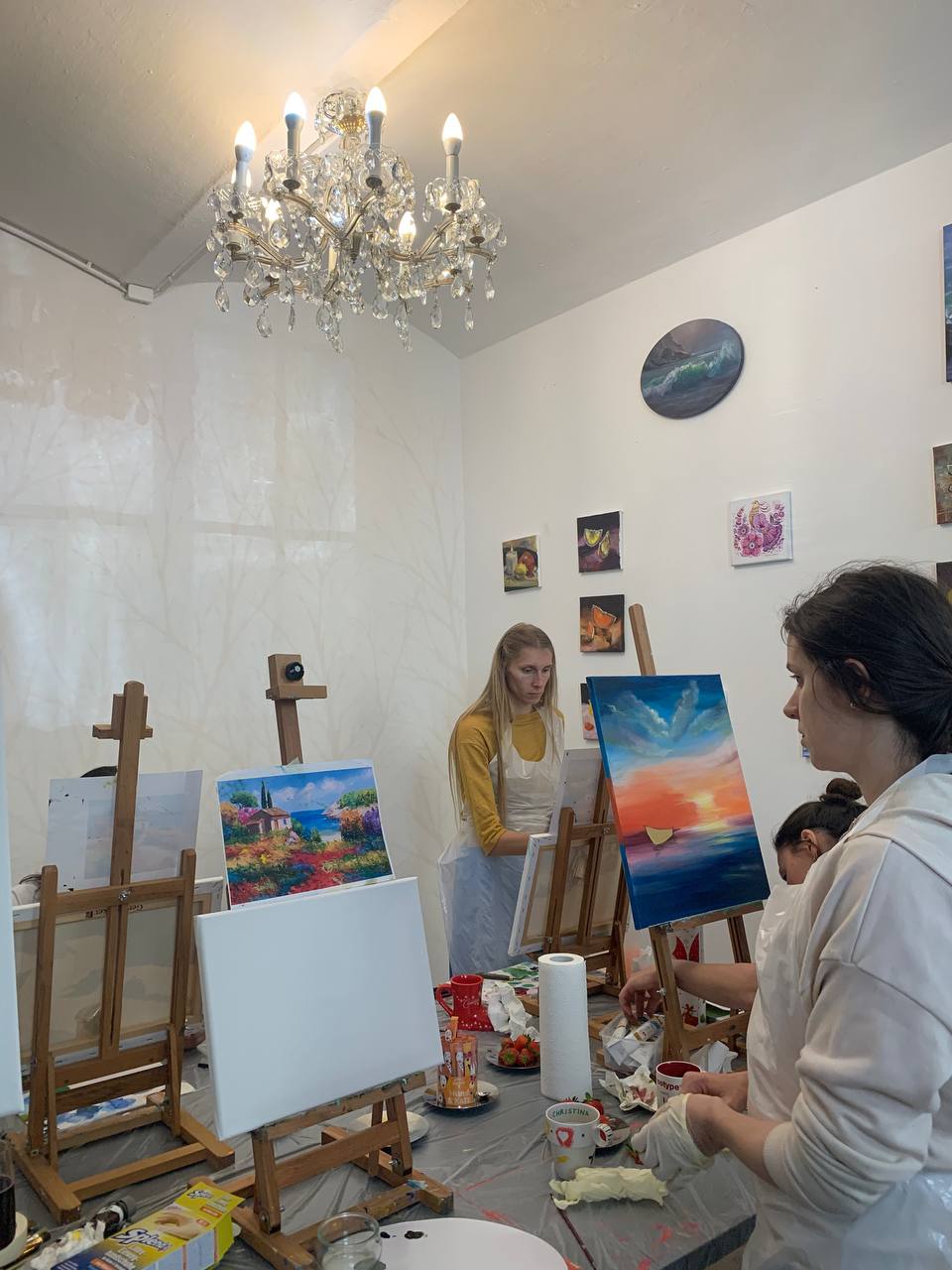 Students painting in the studio